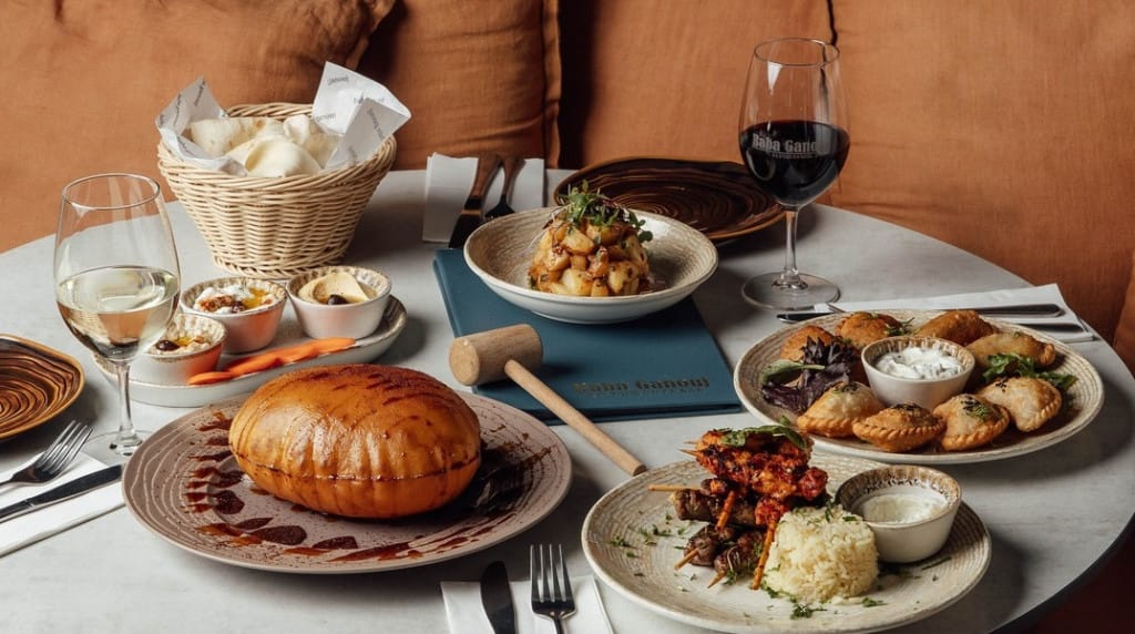 A table filled with Lebanese food and wine