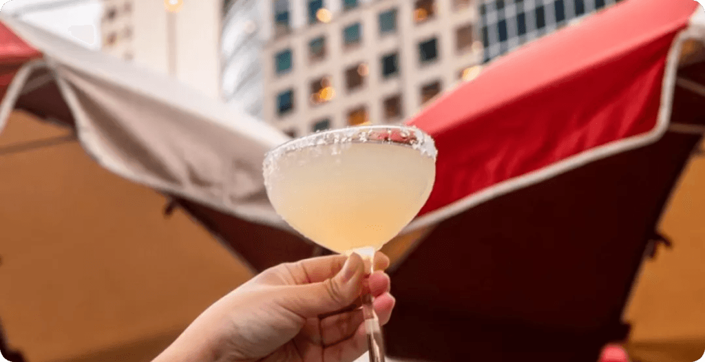 Colorful cocktail served at a rooftop bar