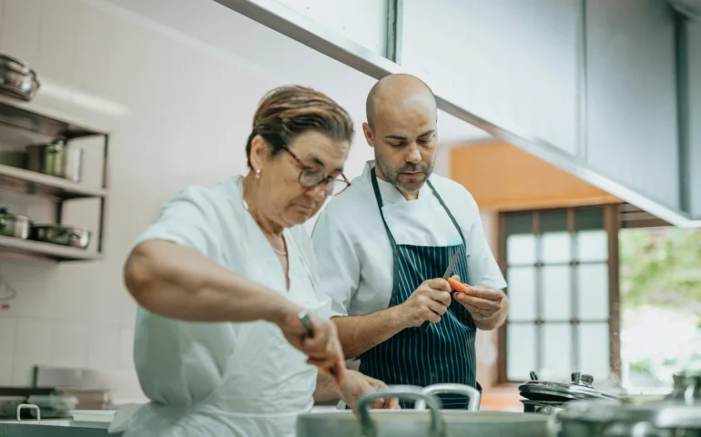 Chefs preparing dishes in a modern Australian restaurant interior