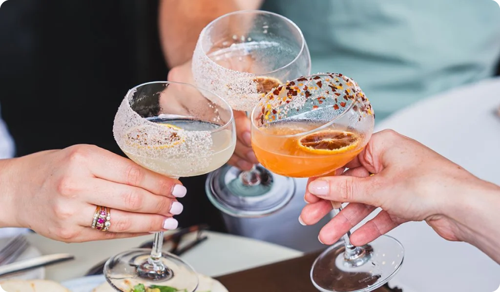 cheers with cocktail glasses