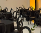 Large event space with elegant decor, dining tables and chairs