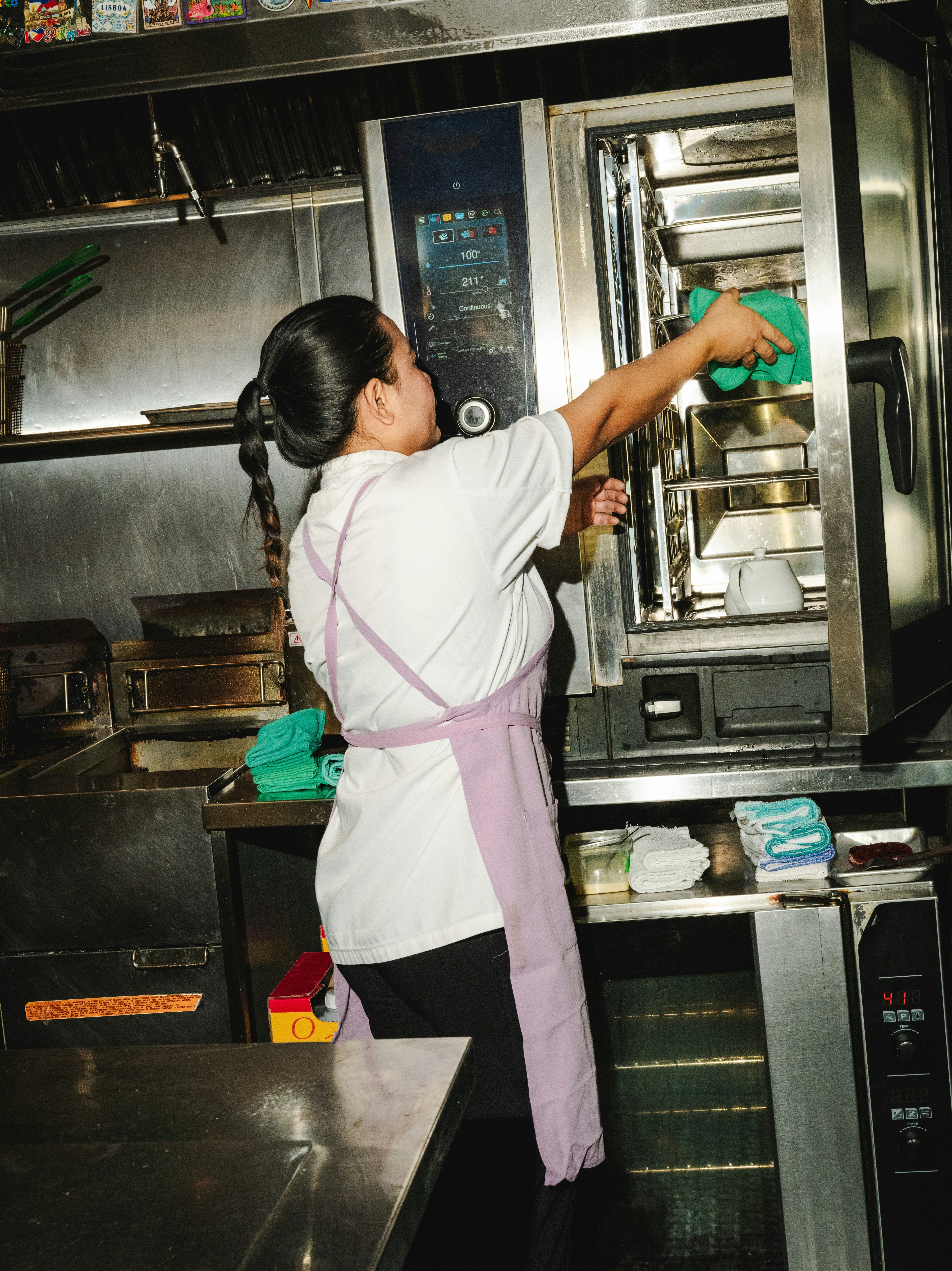 Restaurant staff keeping containers in storage